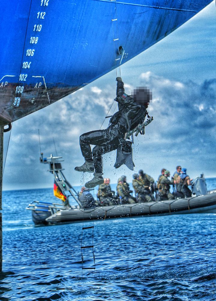 Climbing up from a boat
